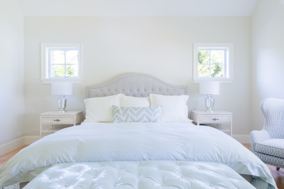Example of a large transitional master light wood floor bedroom design in Boston with white walls and no fireplace