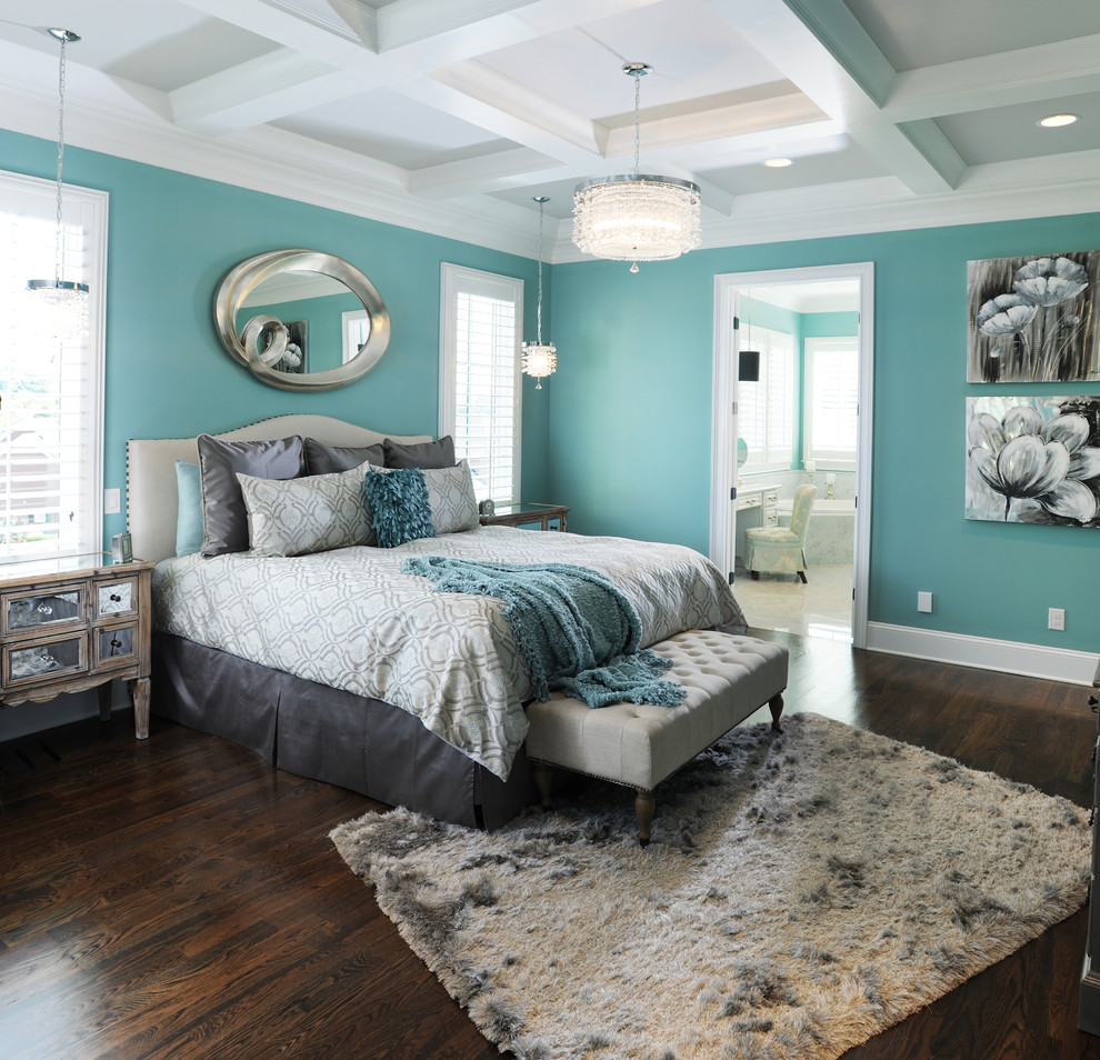 Inspiration for a traditional master and grey and teal bedroom in Nashville with blue walls and dark hardwood flooring.