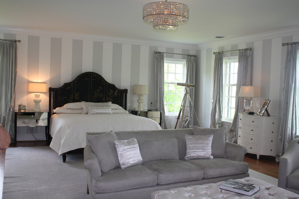 This is an example of a traditional master bedroom in Other with no fireplace.