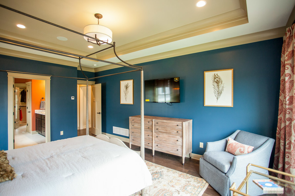 Inspiration for a mid-sized transitional master dark wood floor bedroom remodel in Orange County with blue walls