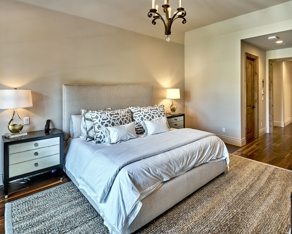 Inspiration for a large farmhouse master bedroom in San Francisco with beige walls, dark hardwood flooring and no fireplace.