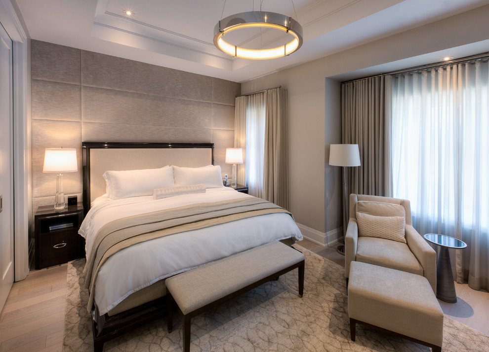 Inspiration for a classic master bedroom in Toronto with beige walls, light hardwood flooring and grey floors.