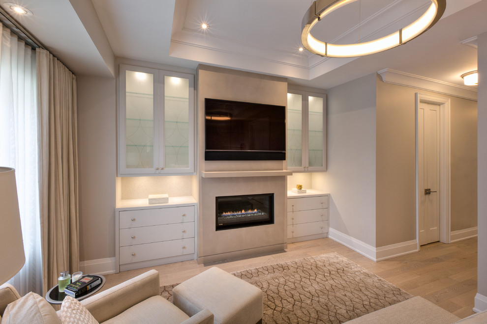 Mid-sized transitional master light wood floor and gray floor bedroom photo in Toronto with gray walls, a ribbon fireplace and a plaster fireplace