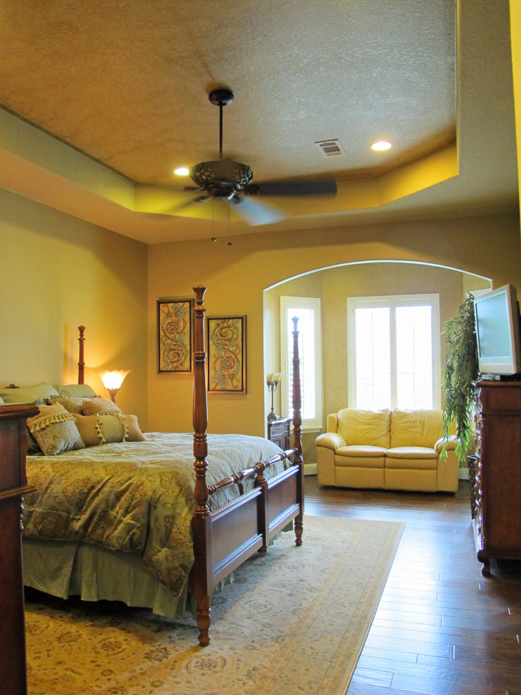 This is an example of a traditional master bedroom in Houston.