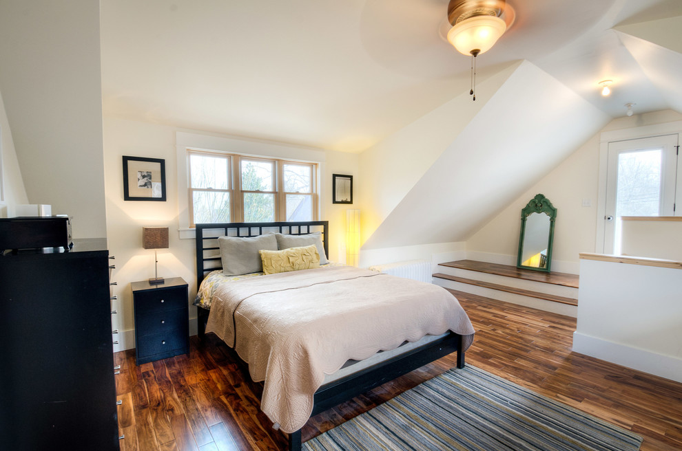 Large classic master bedroom in Denver with white walls, medium hardwood flooring and no fireplace.