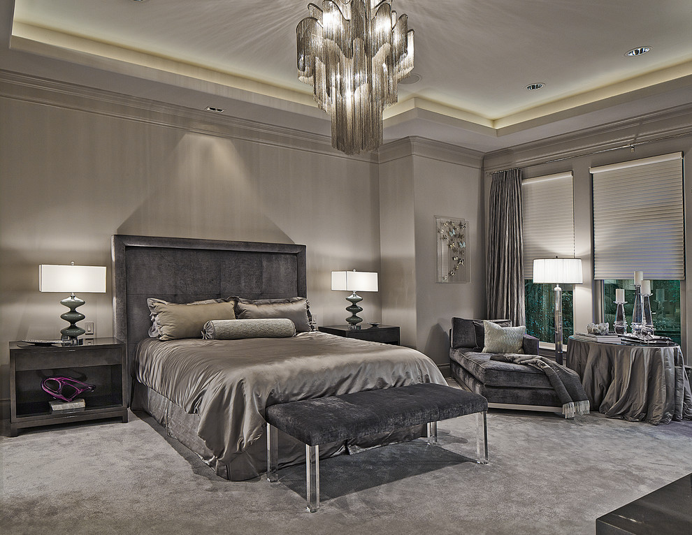Photo of a modern master and grey and silver bedroom in Dallas with grey walls and carpet.