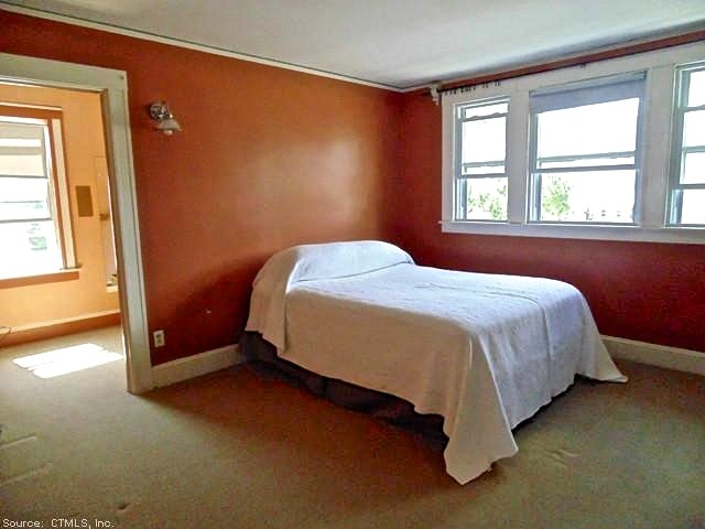 Photo of a classic bedroom in New York with carpet.