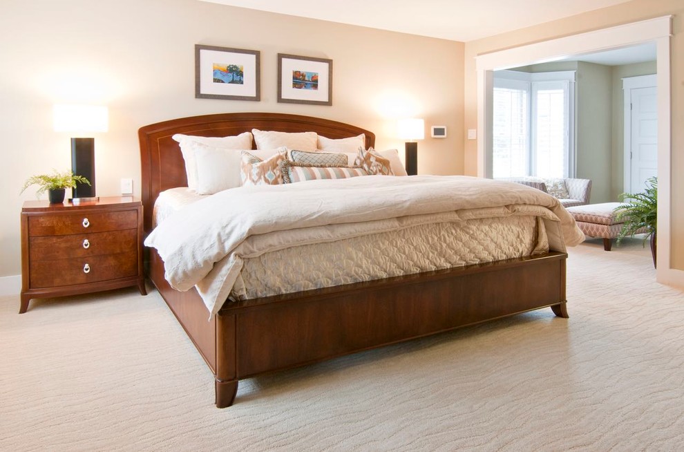 Example of a large transitional master carpeted bedroom design in DC Metro with beige walls and no fireplace