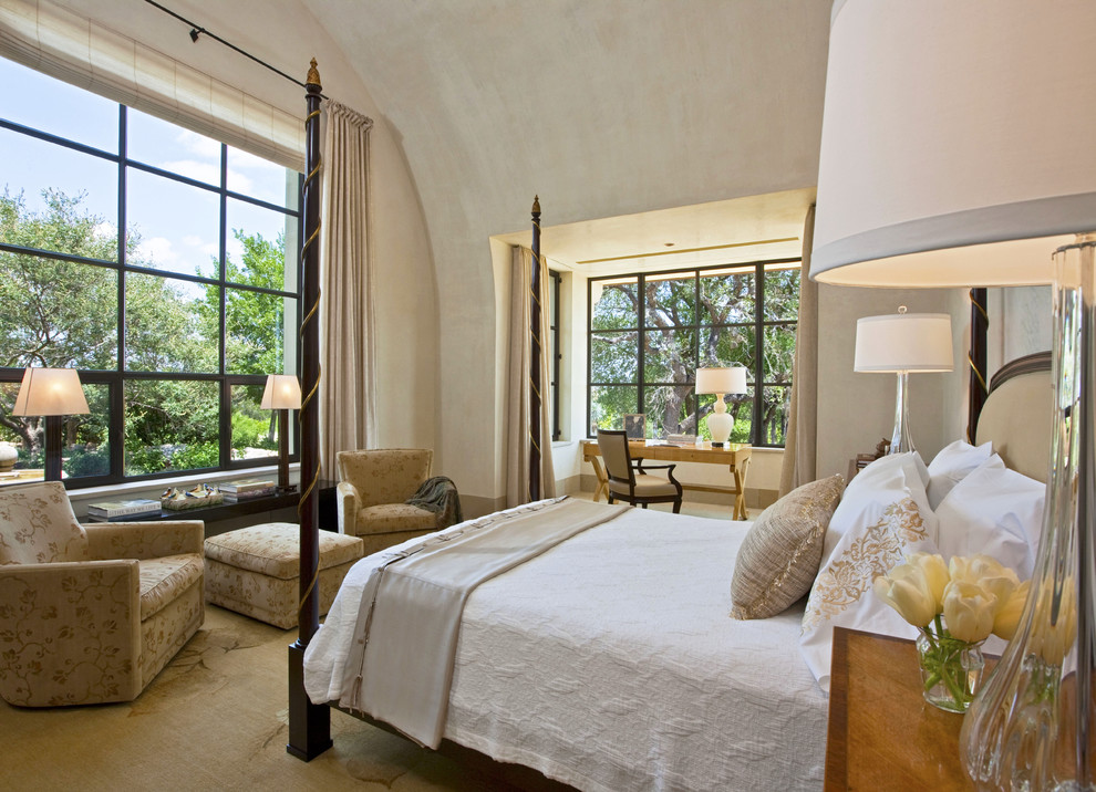 Photo of a large contemporary master bedroom in Austin with beige walls, carpet and no fireplace.
