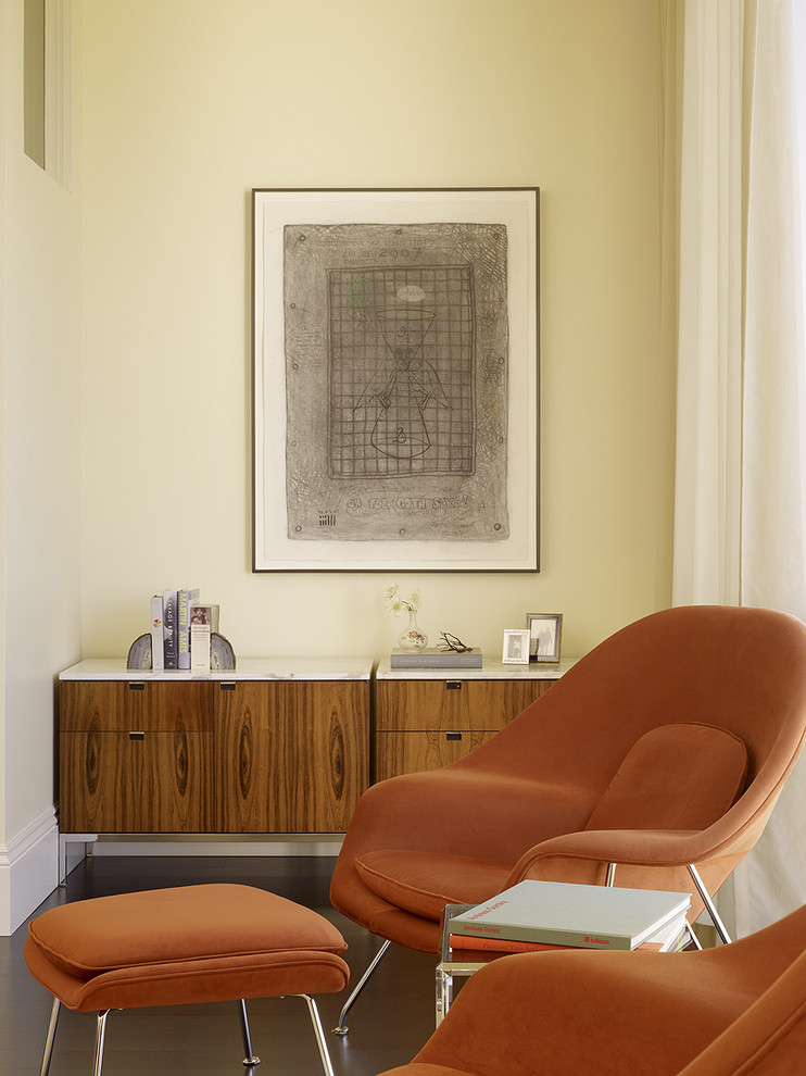 This is an example of a retro bedroom in San Francisco with beige walls.