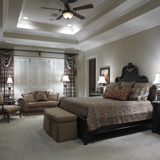 Inspiration for a huge timeless master carpeted bedroom remodel in Austin with beige walls