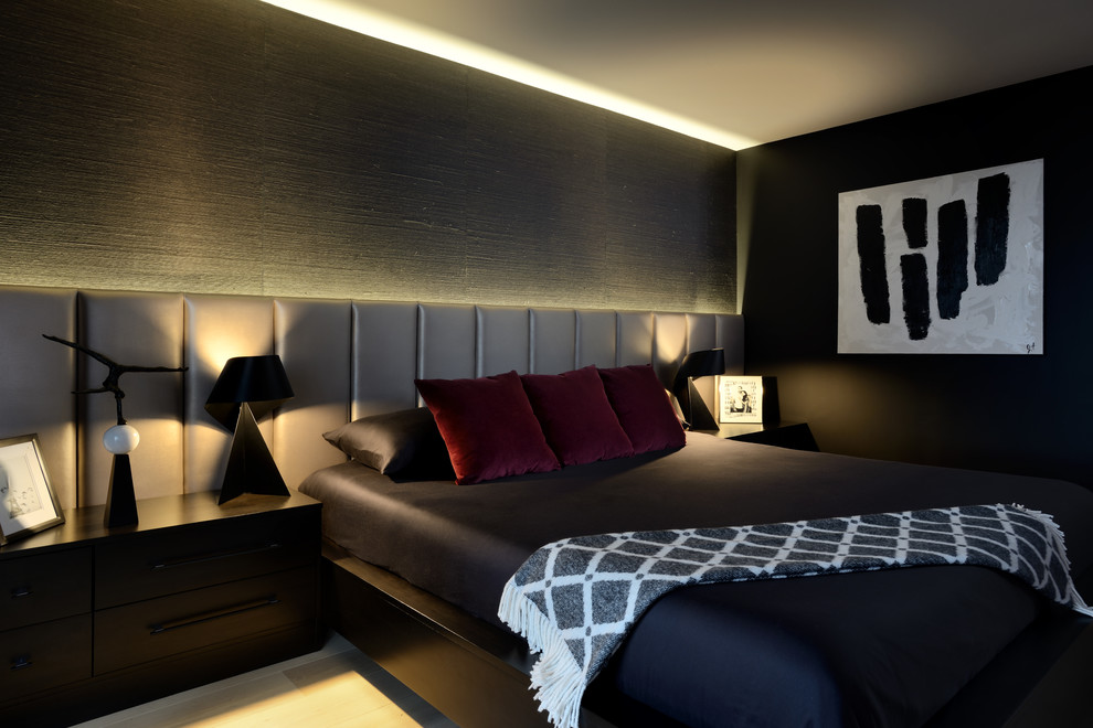 Photo of a medium sized modern master bedroom in Toronto with black walls, light hardwood flooring and beige floors.