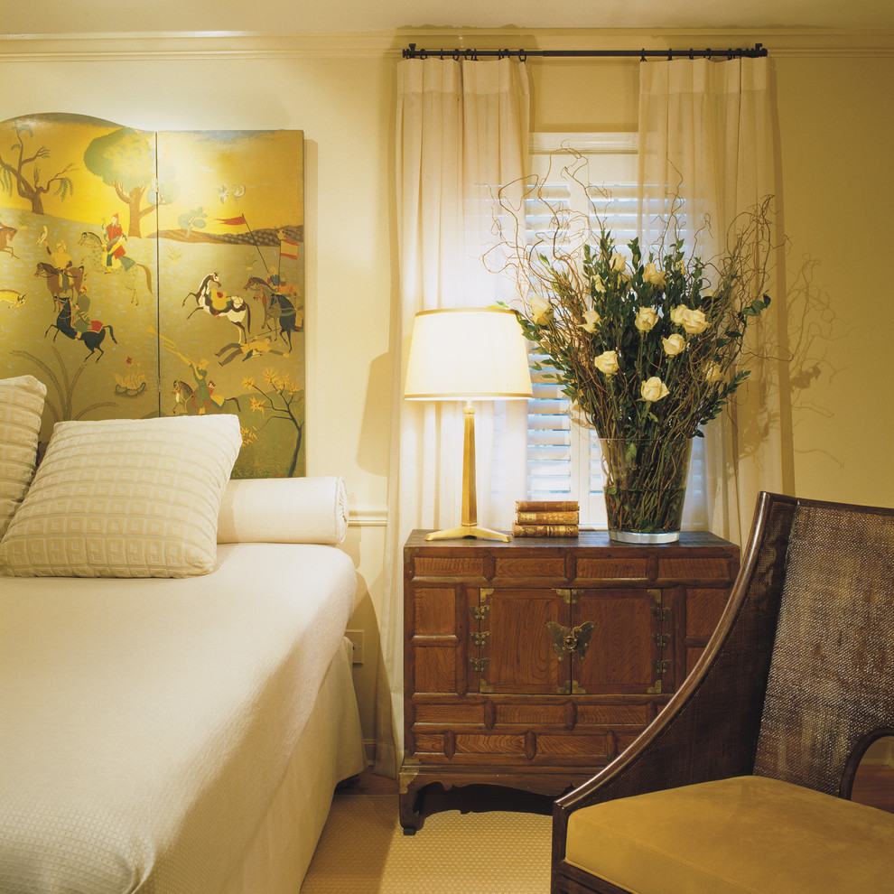 This is an example of a contemporary bedroom in DC Metro with beige walls.