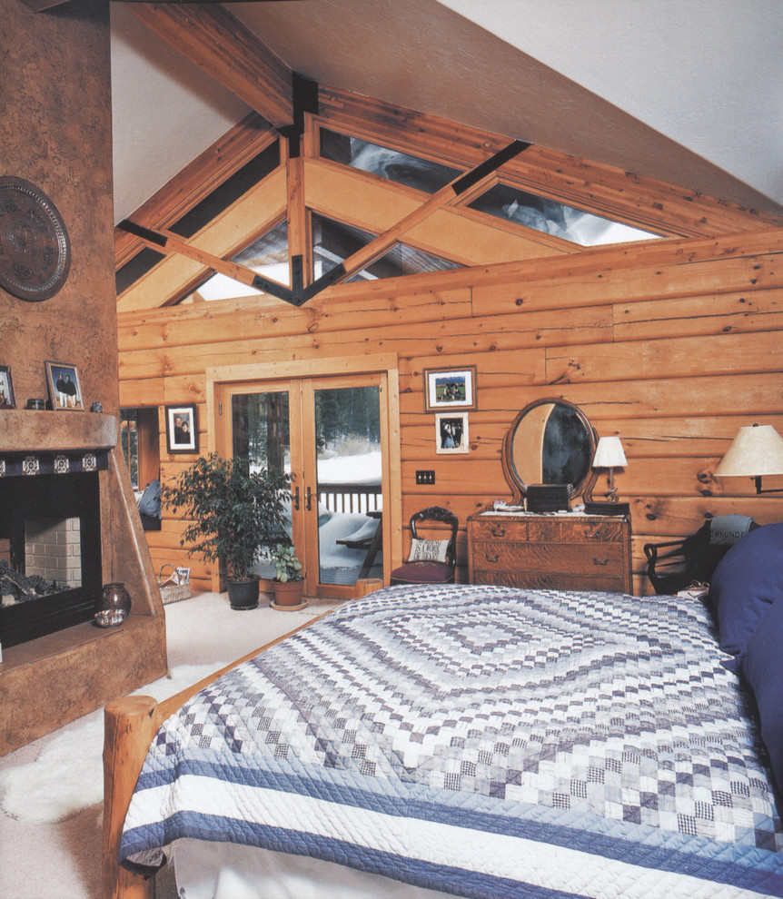 Источник вдохновения для домашнего уюта: спальня в стиле рустика с ковровым покрытием и стандартным камином