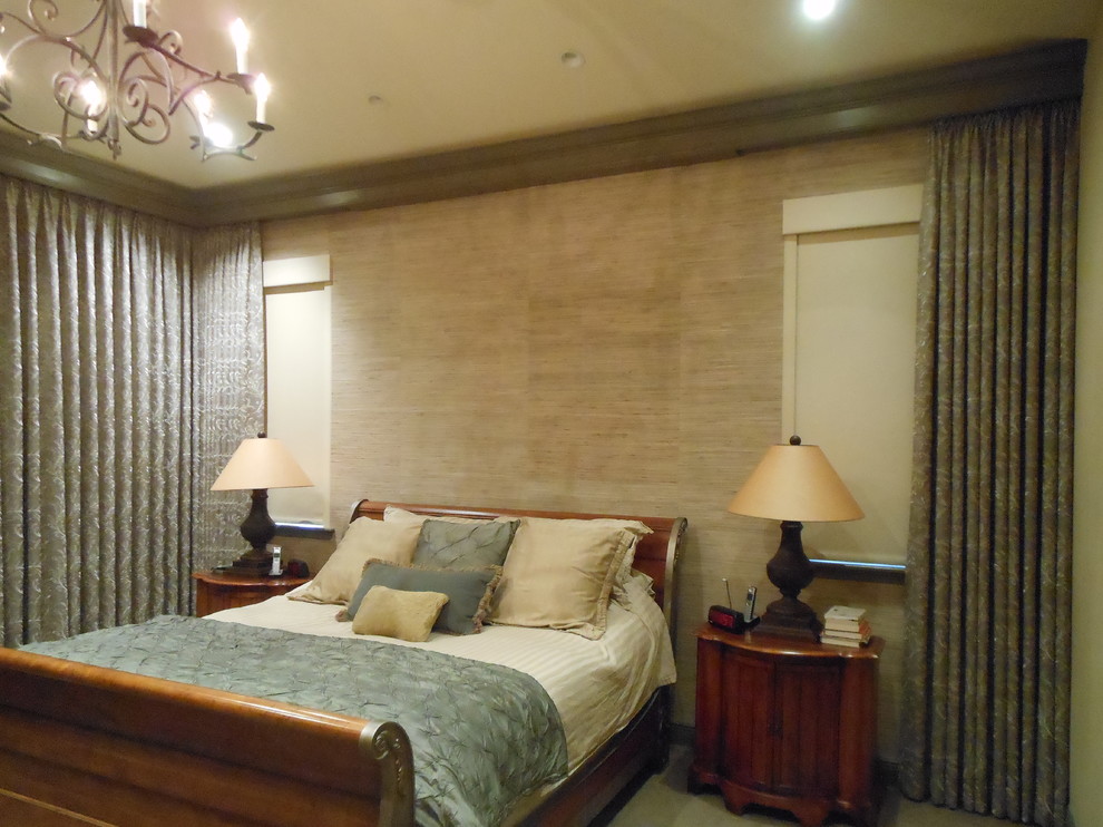 Inspiration for a large mediterranean master bedroom in Miami with brown walls and carpet.