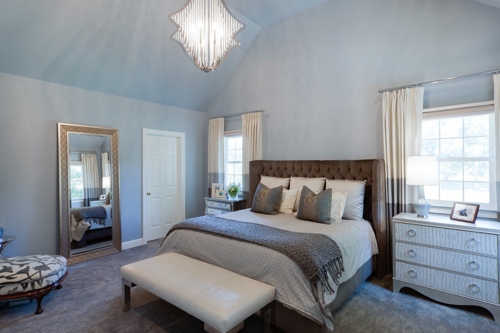 Inspiration for a large transitional master carpeted bedroom remodel in Boston with blue walls