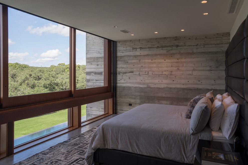 Immagine di una camera da letto minimalista con pareti grigie