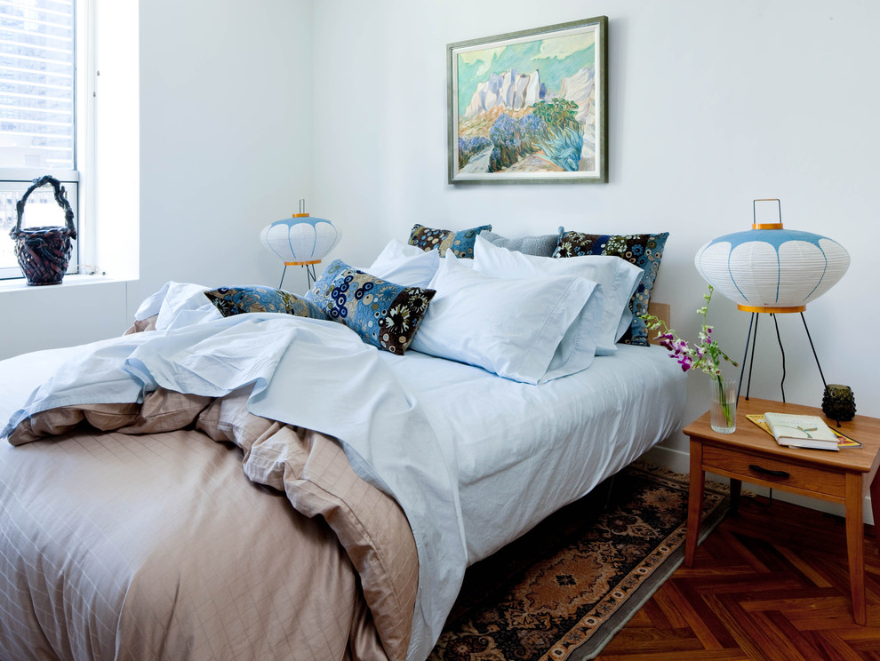 Inspiration for an eclectic bedroom remodel in New York with blue walls