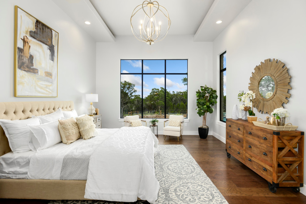 Bedroom - large cottage master dark wood floor, brown floor and vaulted ceiling bedroom idea in Austin with white walls