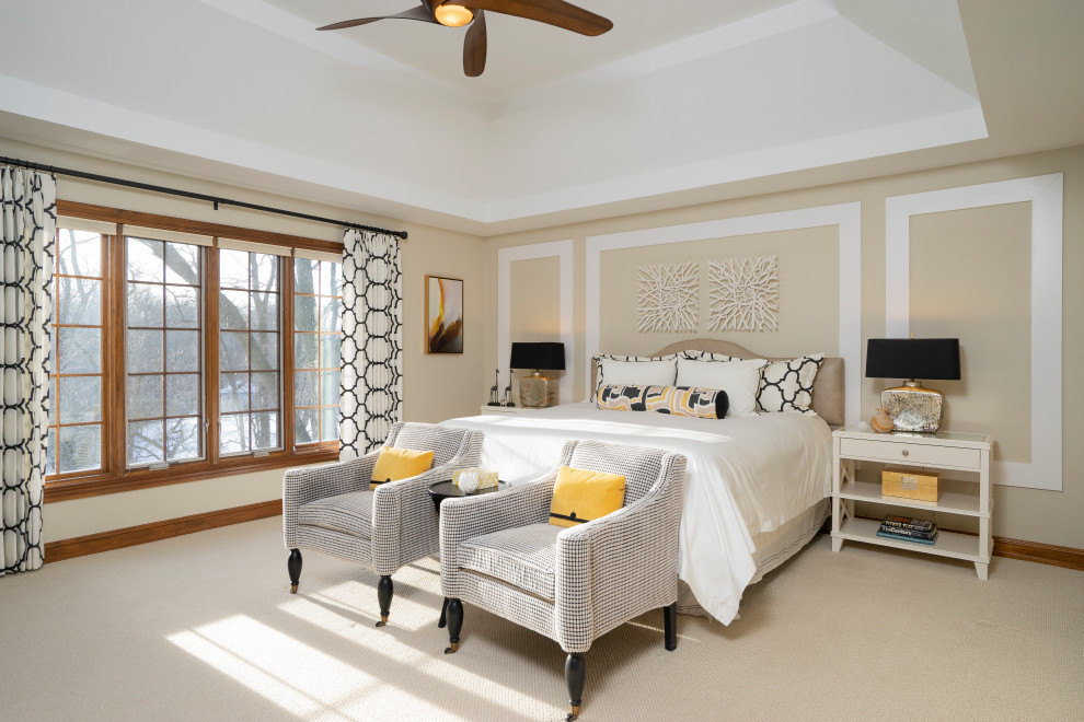 Example of a large transitional master carpeted and beige floor bedroom design in Other with beige walls