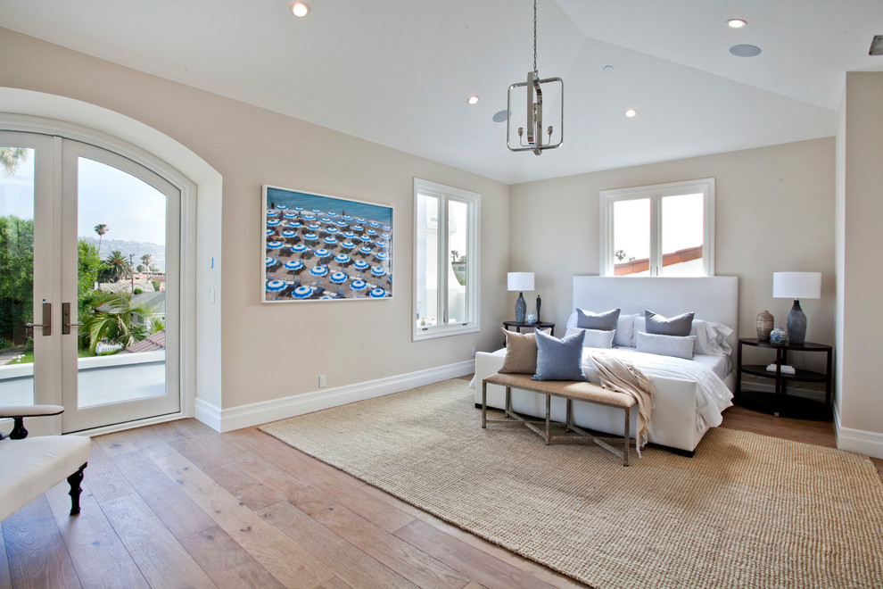 Example of a mid-sized transitional master medium tone wood floor and brown floor bedroom design in Los Angeles with beige walls