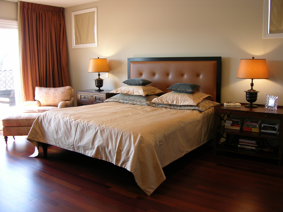 Photo of a traditional master bedroom in Chicago with beige walls, dark hardwood flooring and red floors.