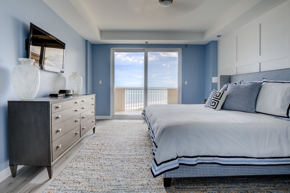 Bedroom - coastal master ceramic tile and gray floor bedroom idea in Jacksonville with blue walls