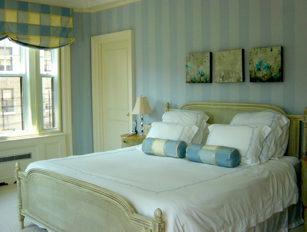 This is an example of a traditional master bedroom in New York with multi-coloured walls.