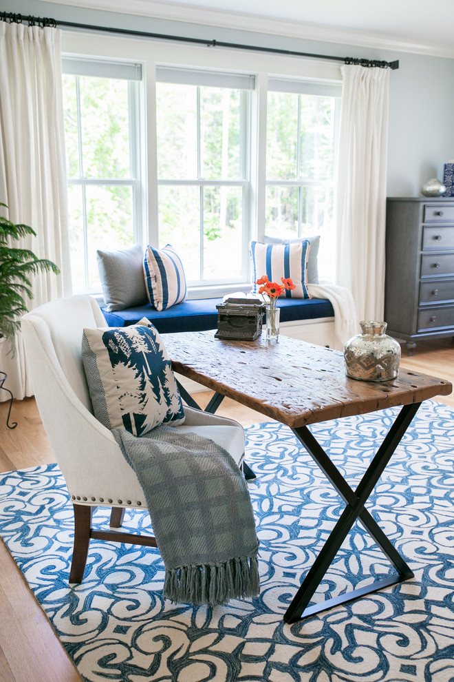 Elegant master light wood floor bedroom photo in Portland Maine with gray walls