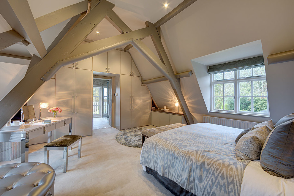 Inspiration for a large farmhouse master carpeted bedroom remodel in Surrey with white walls