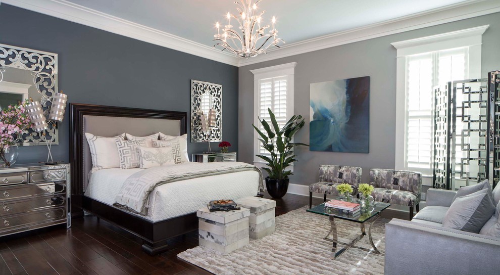На фото: хозяйская спальня среднего размера в стиле неоклассика (современная классика) с серыми стенами, темным паркетным полом и коричневым полом без камина с