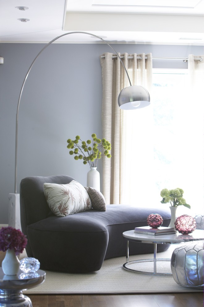 Bedroom - contemporary guest medium tone wood floor bedroom idea in Boston with gray walls and no fireplace