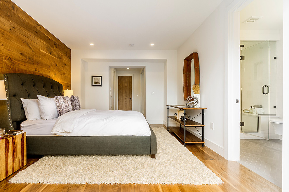 Inspiration for a medium sized contemporary master bedroom in New York with white walls, medium hardwood flooring, no fireplace and beige floors.