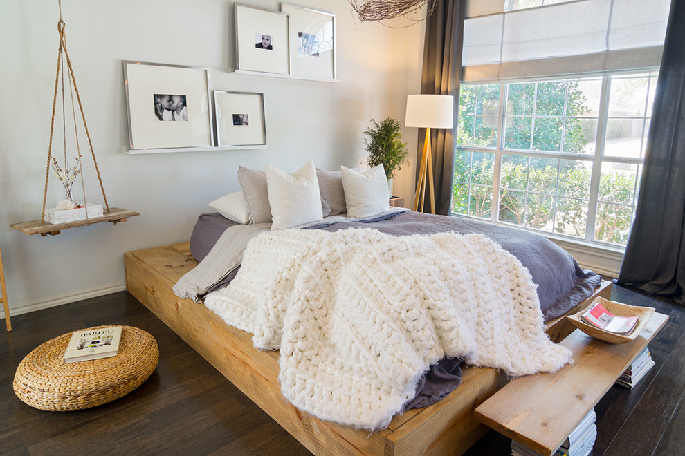 Inspiration for a mid-sized scandinavian master dark wood floor bedroom remodel in Dallas with no fireplace and white walls