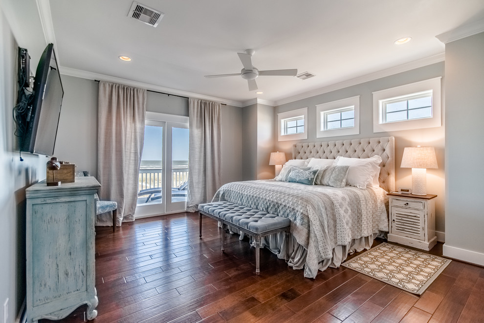 Design ideas for a medium sized nautical guest bedroom in Houston with grey walls, medium hardwood flooring and brown floors.