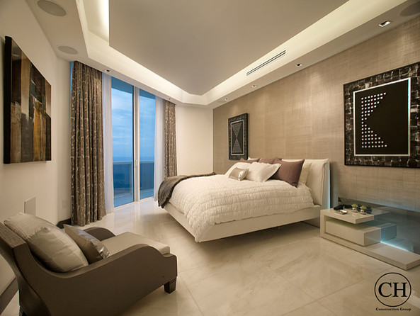 Design ideas for a large modern master bedroom in Miami with marble flooring.