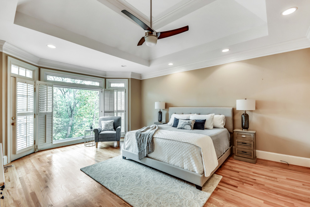 Design ideas for a large traditional master bedroom in Atlanta with dark hardwood flooring.
