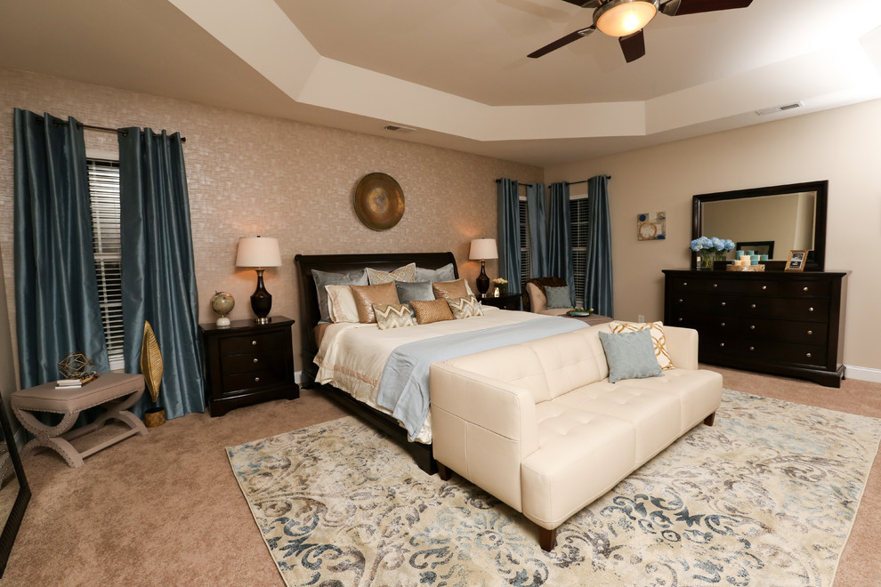 Large contemporary master bedroom in Charlotte with beige walls, carpet and no fireplace.
