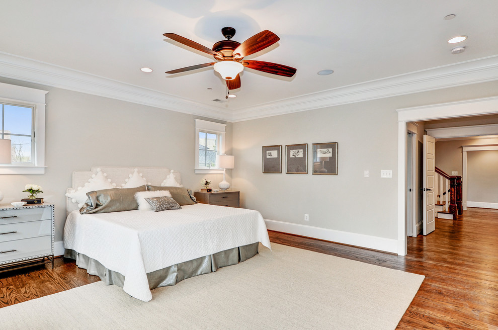 Large transitional master medium tone wood floor and brown floor bedroom photo in DC Metro with gray walls and no fireplace