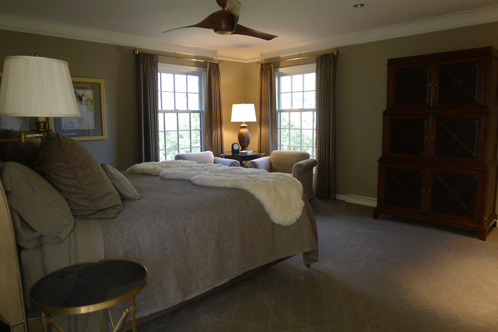 Inspiration for a large classic master bedroom in Indianapolis with brown walls and carpet.