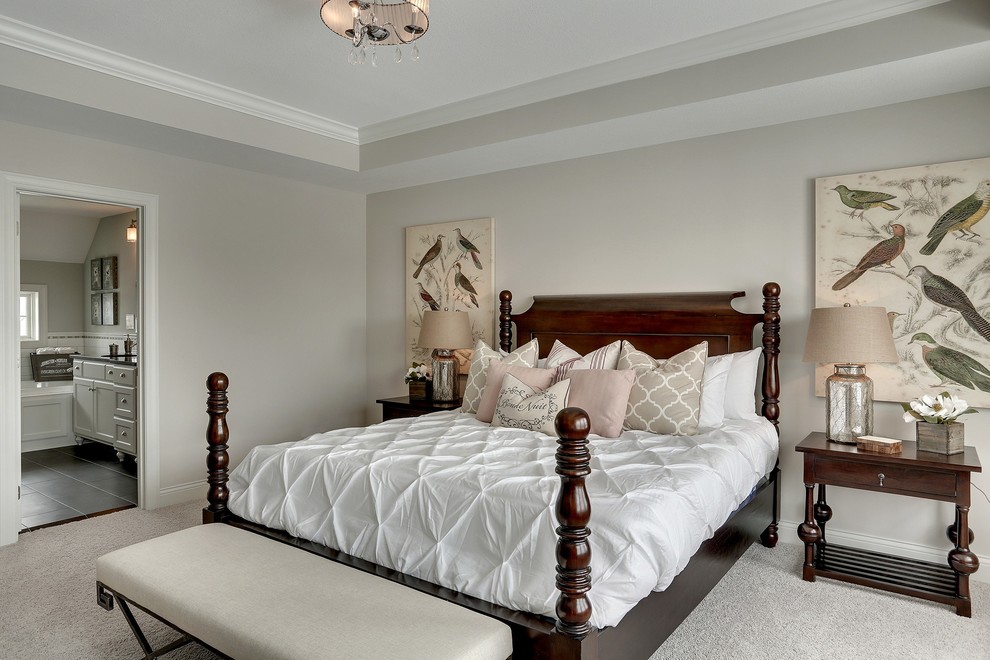 This is an example of a large classic master bedroom in Minneapolis with grey walls and carpet.