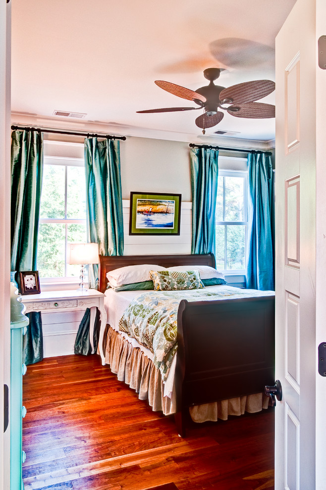Photo of a country bedroom in Charleston with green walls.