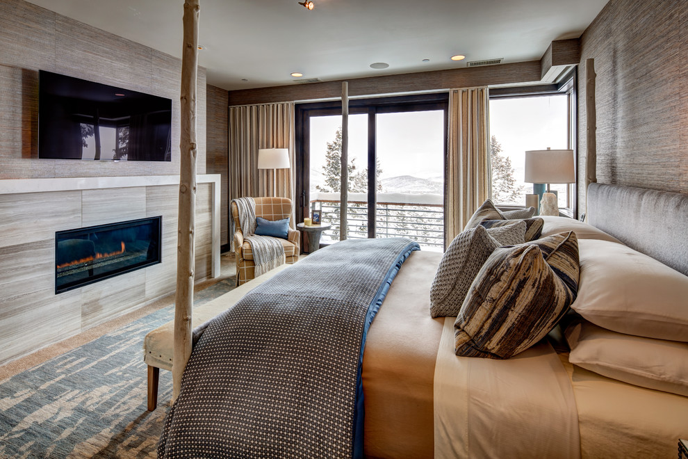 Large rustic master bedroom in Salt Lake City with grey walls, a ribbon fireplace and a tiled fireplace surround.