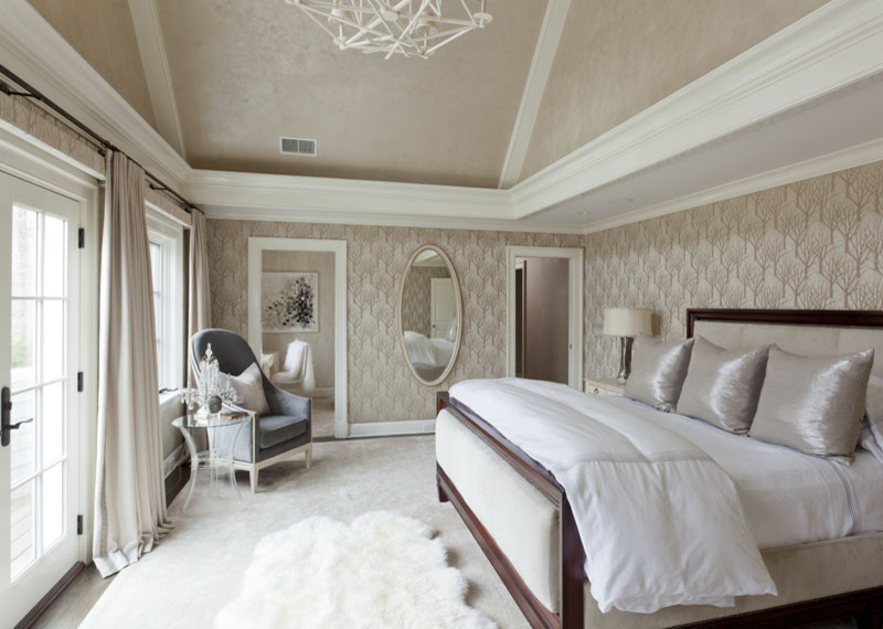 Large transitional master medium tone wood floor bedroom photo in New York with beige walls and no fireplace