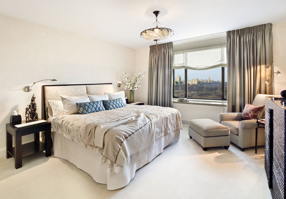 Inspiration for a traditional master bedroom in New York with beige walls.