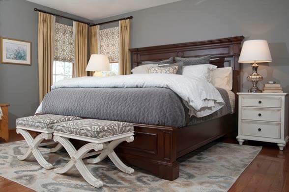 Mid-sized transitional master medium tone wood floor bedroom photo in Philadelphia with gray walls