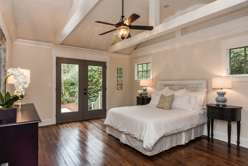 Large arts and crafts master medium tone wood floor and brown floor bedroom photo in Raleigh with beige walls and no fireplace