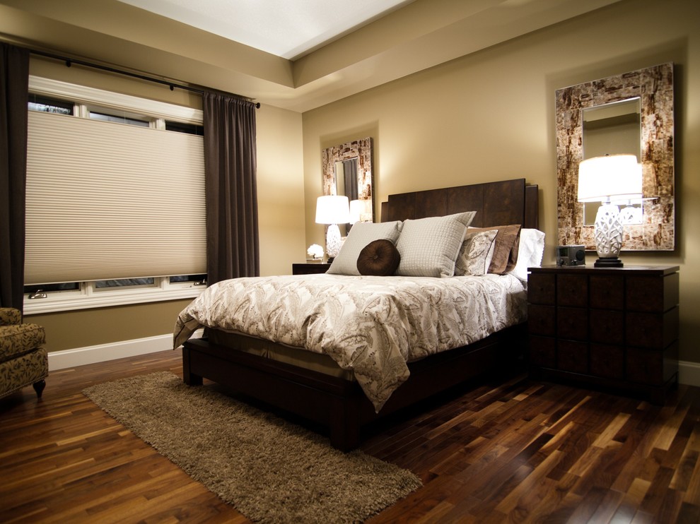Example of a minimalist brown floor bedroom design in Calgary