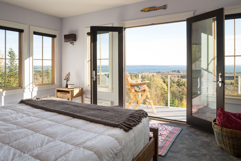 Example of a transitional bedroom design in Portland Maine with blue walls