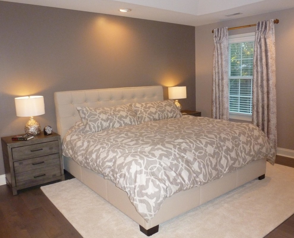 Photo of a large classic master bedroom in Philadelphia with medium hardwood flooring, no fireplace and beige walls.